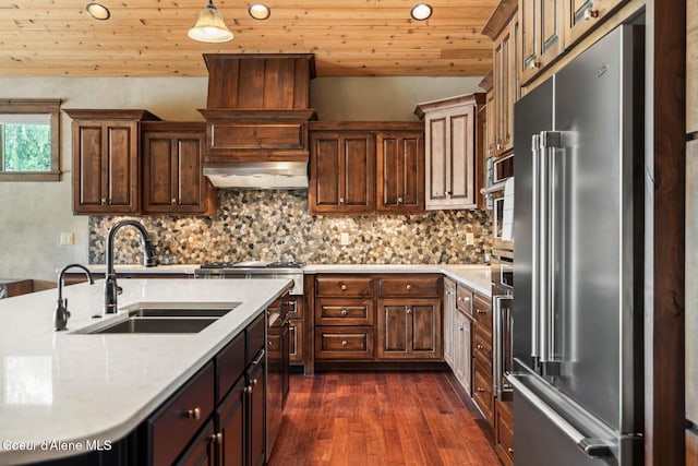 11 Canoe Cv, Dover, ID 83825 - kitchen with high end refrigerator, light countertops, dark wood finished floors, decorative backsplash, and lofted ceiling