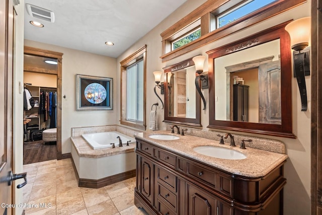 11 Canoe Cv, Dover, ID 83825 - full bath featuring double vanity, a bath, and recessed lighting