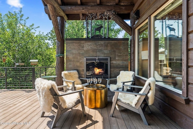 11 Canoe Cv, Dover, ID 83825 - wooden deck featuring a tile fireplace
