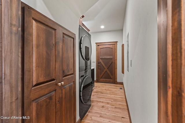 11 Canoe Cv, Dover, ID 83825 - laundry area with stacked washing machine and dryer, light wood finished floors, and recessed lighting