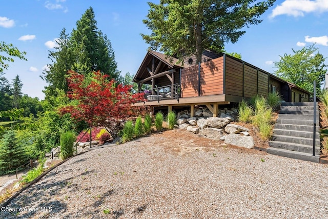 11 Canoe Cv, Dover, ID 83825 - view of front facade with stairs and a wooden deck