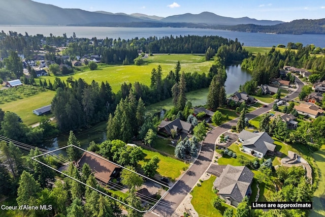 11 Canoe Cv, Dover, ID 83825 - aerial view of property and surrounding area featuring a water and mountain view and property parcel outlined