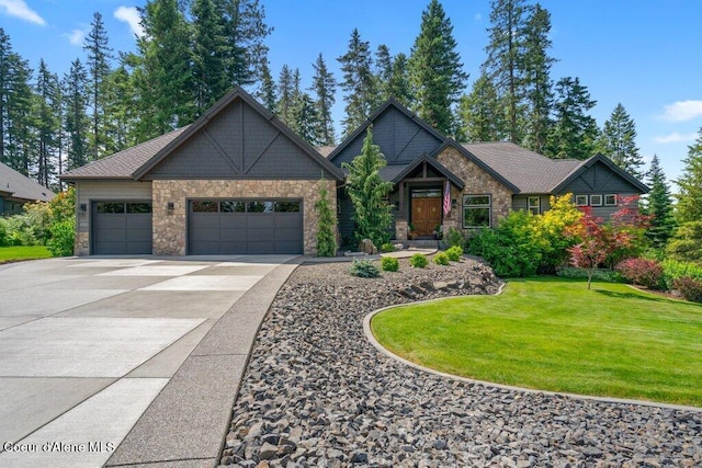 3742 W Cielo View Ct, Coeur Dalene, ID 83814 - craftsman house featuring stone siding, a garage, concrete driveway, and a front yard