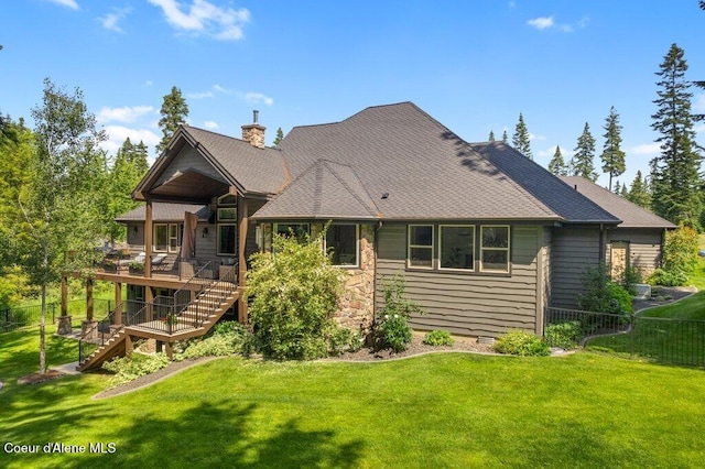 3742 W Cielo View Ct, Coeur Dalene, ID 83814 - back of property with stairway, a deck, and a chimney