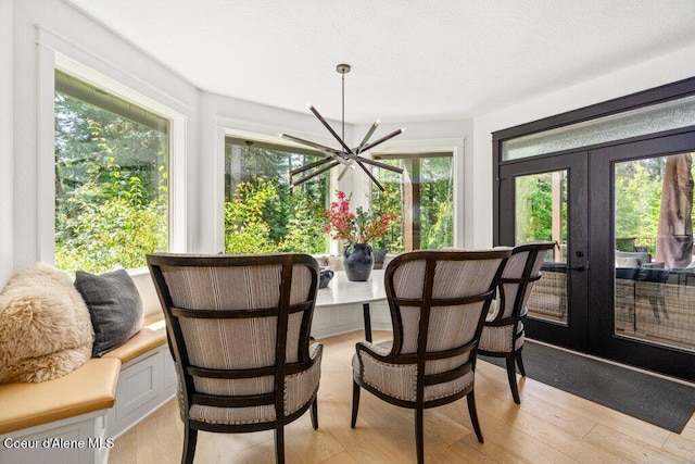 3742 W Cielo View Ct, Coeur Dalene, ID 83814 - dining area featuring healthy amount of natural light, light wood finished floors, and french doors