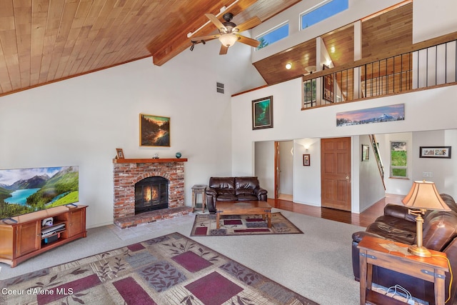 7722 W Clemetson Rd, Coeur Dalene, ID 83814 - living room featuring a wood ceiling with exposed beams, a ceiling fan, carpet floors, high vaulted ceiling, and a brick fireplace