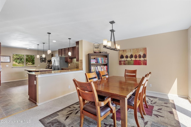 7722 W Clemetson Rd, Coeur Dalene, ID 83814 - dining room featuring a chandelier and recessed lighting