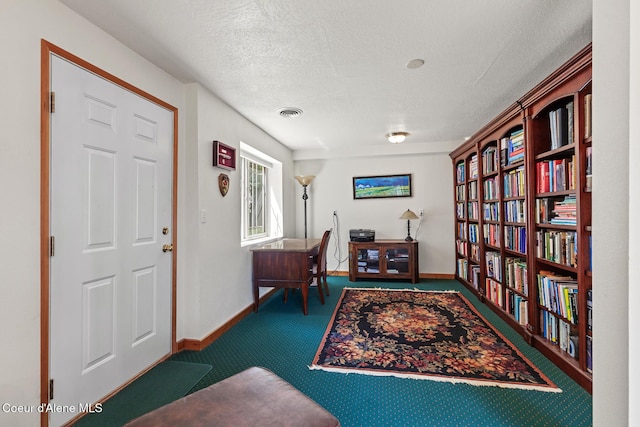 7722 W Clemetson Rd, Coeur Dalene, ID 83814 - carpeted home office with baseboards and a textured ceiling