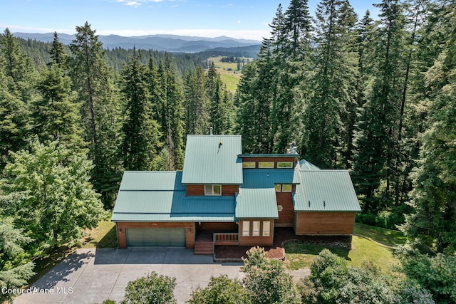 7722 W Clemetson Rd, Coeur Dalene, ID 83814 - view of subject property featuring a forest and mountains