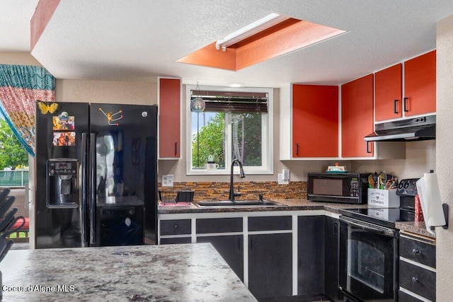 1503 E 3rd Ave, Post Falls, ID 83854 - kitchen featuring black appliances, under cabinet range hood, and dark countertops