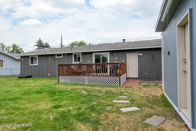 1503 E 3rd Ave, Post Falls, ID 83854 - back of property with a wooden deck and roof with shingles