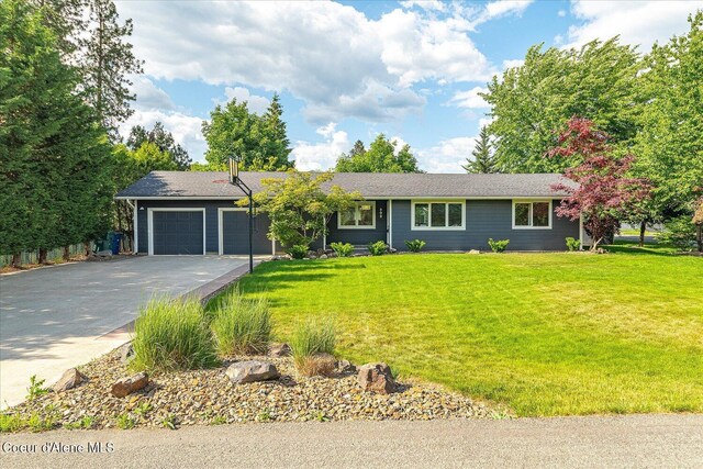 502 W 14th Ave, Post Falls, ID 83854 - ranch-style home with driveway, an attached garage, and a front yard