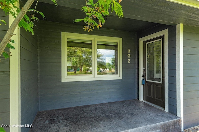 502 W 14th Ave, Post Falls, ID 83854 - doorway to property featuring covered porch