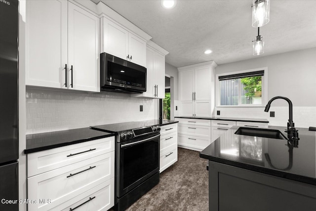 502 W 14th Ave, Post Falls, ID 83854 - kitchen with range with electric cooktop, dark countertops, refrigerator, tasteful backsplash, and white cabinets
