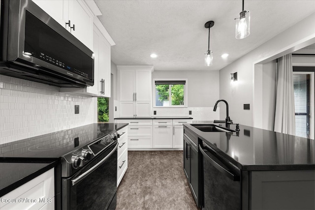 502 W 14th Ave, Post Falls, ID 83854 - kitchen featuring electric range, stainless steel microwave, dishwasher, dark countertops, and recessed lighting