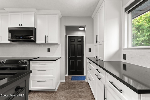 502 W 14th Ave, Post Falls, ID 83854 - kitchen with dark countertops, black / electric stove, white cabinetry, tasteful backsplash, and a textured ceiling