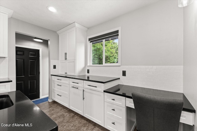 502 W 14th Ave, Post Falls, ID 83854 - kitchen with dark countertops, decorative backsplash, an office area, white cabinets, and recessed lighting
