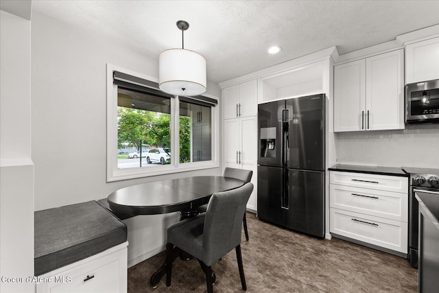 502 W 14th Ave, Post Falls, ID 83854 - dining area with a textured ceiling and recessed lighting
