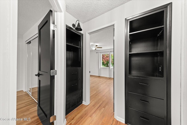 502 W 14th Ave, Post Falls, ID 83854 - hall with a textured ceiling and light wood finished floors