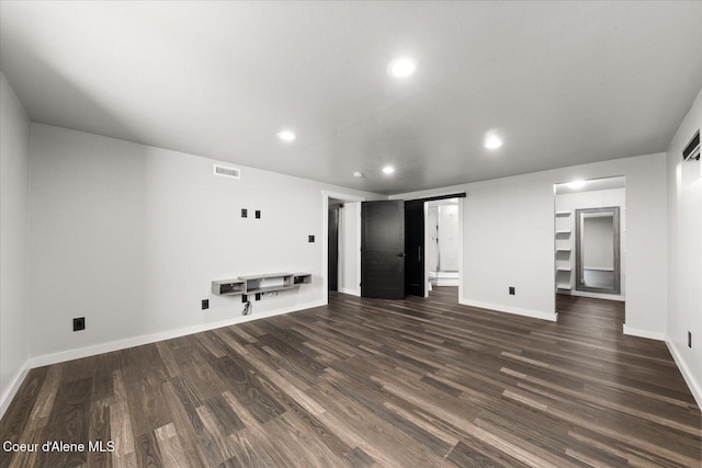 502 W 14th Ave, Post Falls, ID 83854 - unfurnished living room with recessed lighting and dark wood finished floors