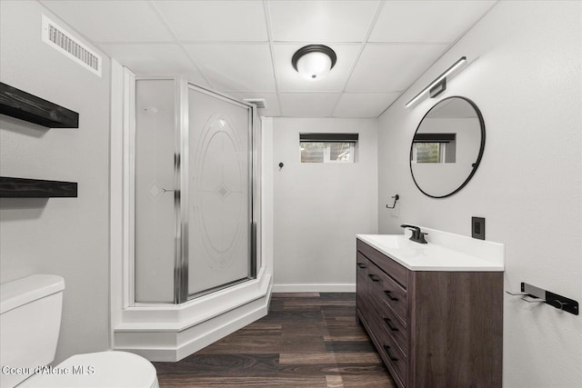 502 W 14th Ave, Post Falls, ID 83854 - bathroom featuring a drop ceiling, vanity, a shower stall, and wood finished floors