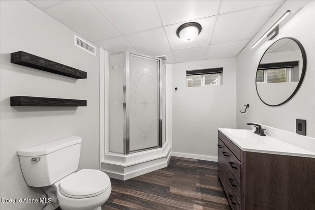 502 W 14th Ave, Post Falls, ID 83854 - bathroom with a paneled ceiling, vanity, a stall shower, and wood finished floors