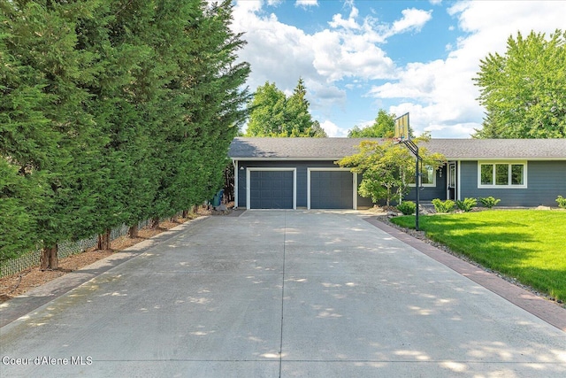 502 W 14th Ave, Post Falls, ID 83854 - view of front of house with an attached garage, concrete driveway, and a front yard