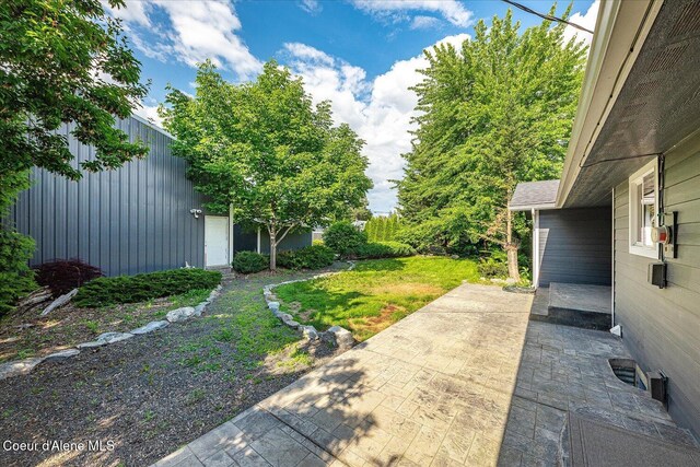 502 W 14th Ave, Post Falls, ID 83854 - view of grassy yard with a patio