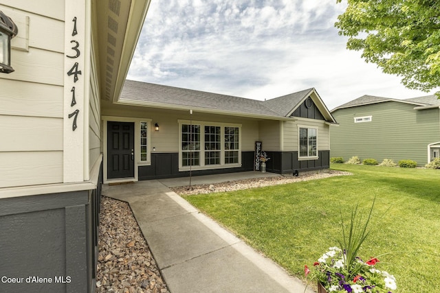 13417 N Halley St, Rathdrum, ID 83858 - back of property with board and batten siding and a lawn