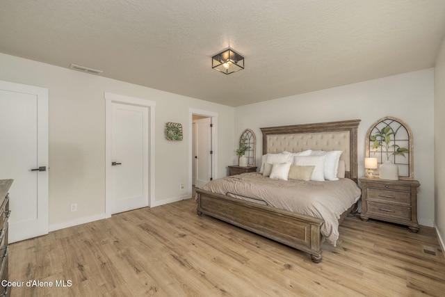 13417 N Halley St, Rathdrum, ID 83858 - bedroom featuring light wood-style flooring and baseboards