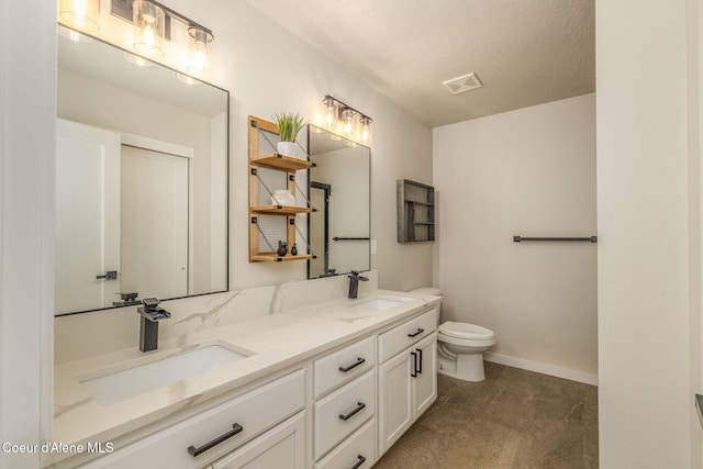 13417 N Halley St, Rathdrum, ID 83858 - bathroom featuring double vanity and a textured ceiling