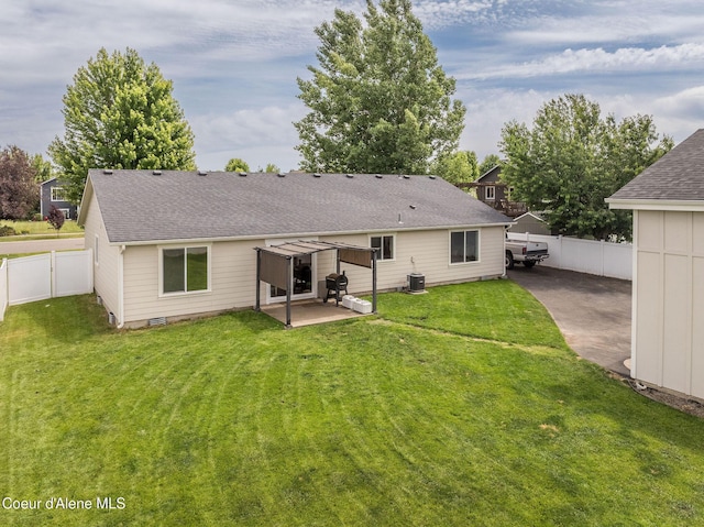 13417 N Halley St, Rathdrum, ID 83858 - back of house with a patio area, roof with shingles, and a fenced backyard