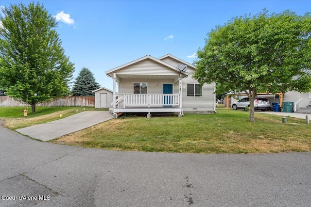 2270 W Linda Way, Post Falls, ID 83854 - view of front of home with a porch, a storage shed, driveway, and crawl space