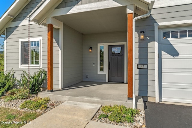 52 Peggys Ct, Dover, ID 83825 - entrance to property with covered porch and a garage