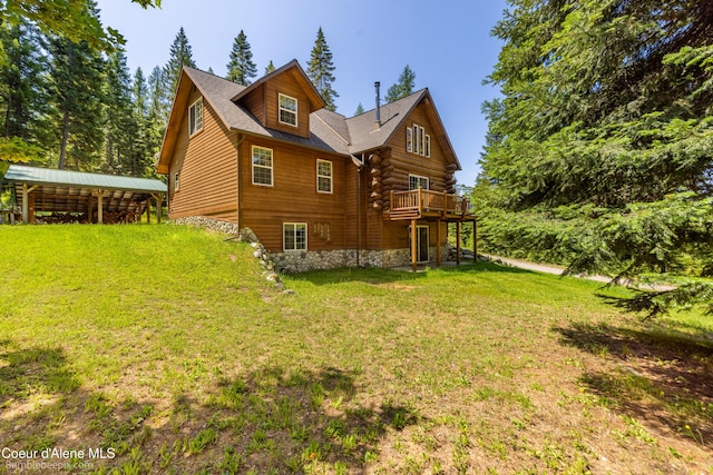 4900 E Hudlow Rd, Hayden, ID 83835 - view of home's exterior featuring a yard, a wooden deck, and stone siding