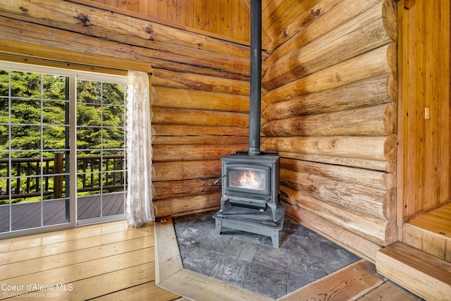 4900 E Hudlow Rd, Hayden, ID 83835 - detailed view of a wood stove and log walls