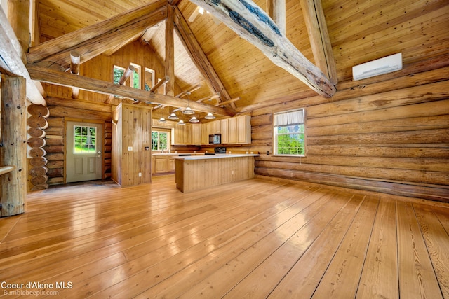 4900 E Hudlow Rd, Hayden, ID 83835 - kitchen with light brown cabinets, high vaulted ceiling, light wood-style floors, light countertops, and a wood ceiling with exposed beams