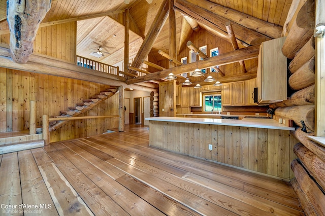 4900 E Hudlow Rd, Hayden, ID 83835 - kitchen featuring light wood-style floors, light countertops, high vaulted ceiling, light brown cabinetry, and a wooden ceiling with exposed beams
