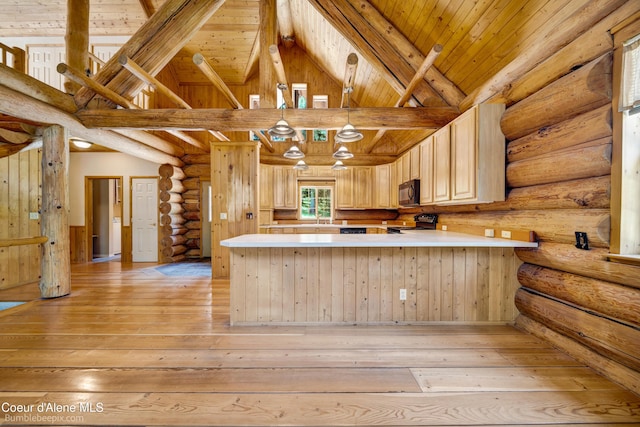 4900 E Hudlow Rd, Hayden, ID 83835 - kitchen with electric range oven, black microwave, light brown cabinets, light wood-style floors, and light countertops