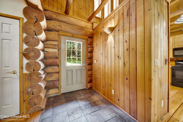 4900 E Hudlow Rd, Hayden, ID 83835 - doorway featuring log walls and stone finish flooring