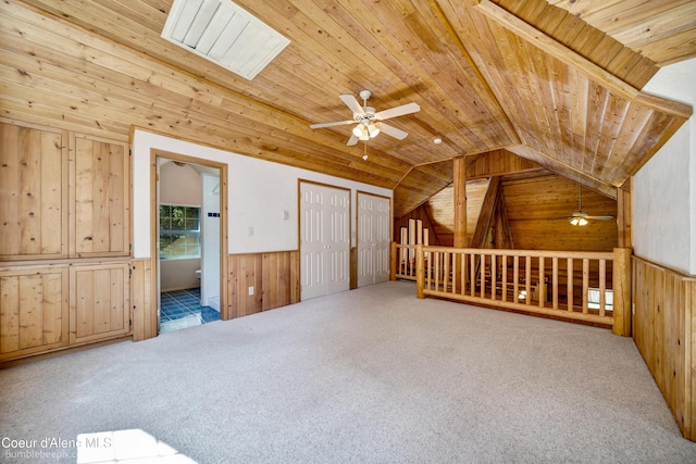 4900 E Hudlow Rd, Hayden, ID 83835 - additional living space with wooden walls, ceiling fan, wood ceiling, vaulted ceiling, and carpet