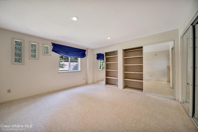 4900 E Hudlow Rd, Hayden, ID 83835 - unfurnished bedroom with carpet, recessed lighting, and multiple closets