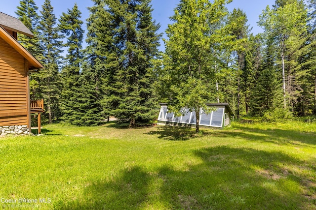 4900 E Hudlow Rd, Hayden, ID 83835 - view of grassy yard with a storage unit