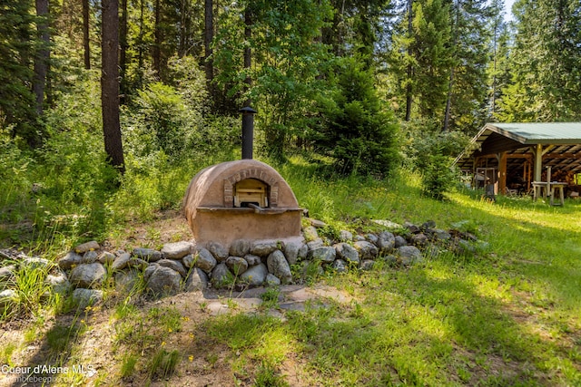 4900 E Hudlow Rd, Hayden, ID 83835 - view of yard with a wooded view