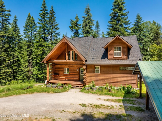 4900 E Hudlow Rd, Hayden, ID 83835 - log cabin featuring a shingled roof and log siding