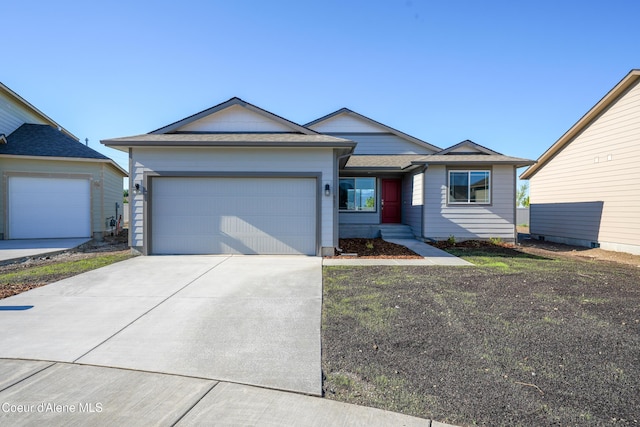 10519 Liverpool Loop, Hayden, ID 83835 - single story home with concrete driveway and a garage
