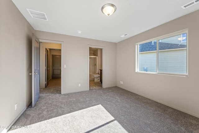 10519 Liverpool Loop, Hayden, ID 83835 - unfurnished bedroom featuring carpet and connected bathroom