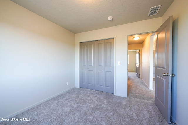 10519 Liverpool Loop, Hayden, ID 83835 - unfurnished bedroom with carpet floors and a closet