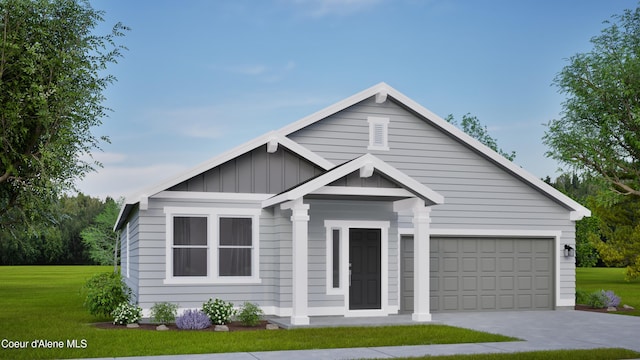 13636 N Apex Way, Hayden, ID 83835 - view of front of home featuring board and batten siding, a front lawn, concrete driveway, and an attached garage