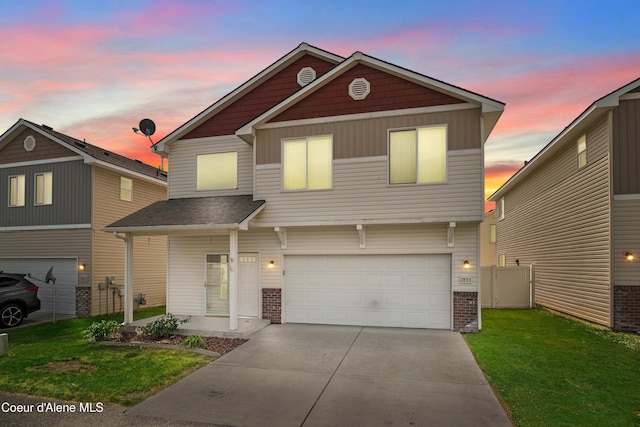 7833 N Hilliard Ct, Coeur Dalene, ID 83815 - view of front of property featuring brick siding, a garage, and concrete driveway